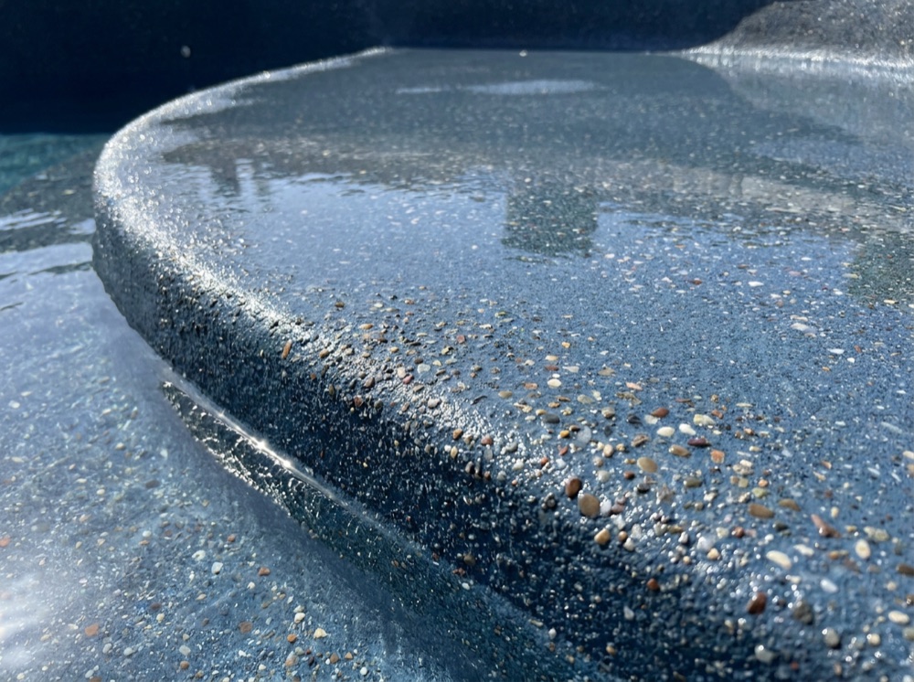 Freshly resurfaced swimming pool with new pebble finish in Las Vegas